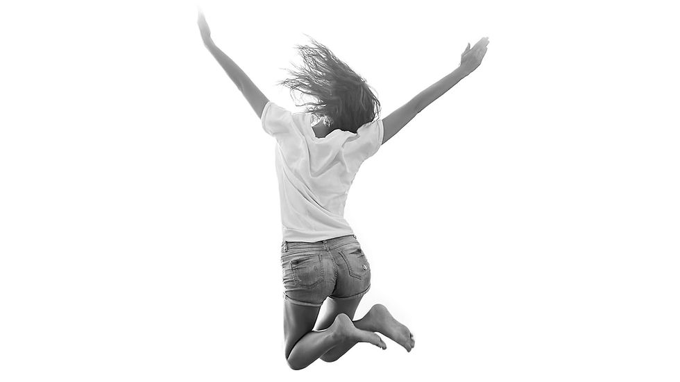 Woman jumping in joy