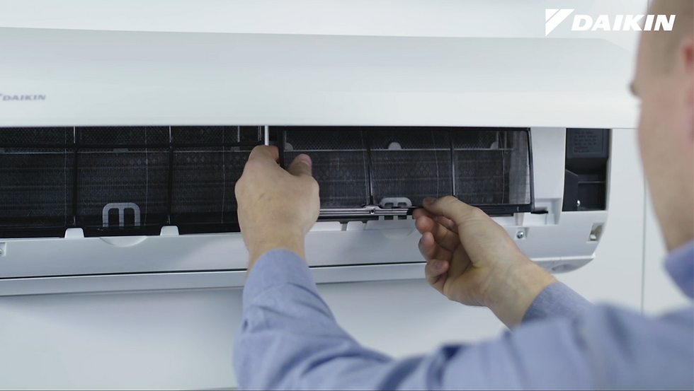 Daikin Service Technician Cleaning Split System Filter