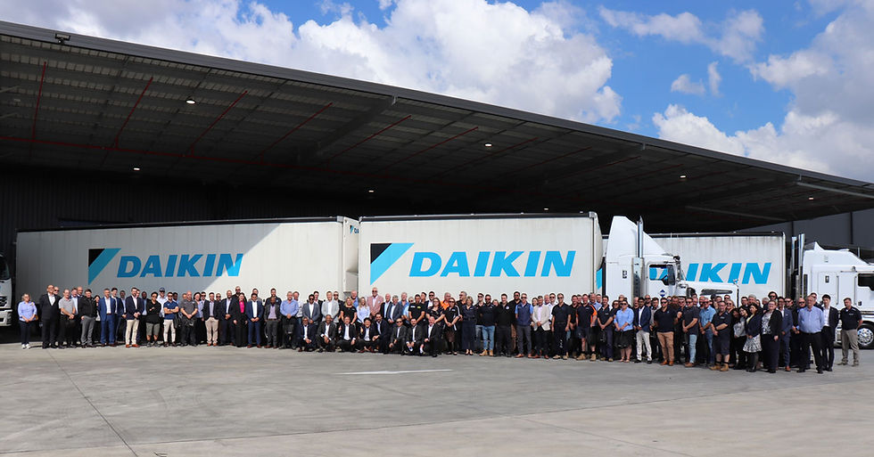 Image 3: Guests gathered in front of a Daikin B-Double during the opening of Daikin Park Brisbane this week.