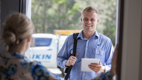 Daikin Specialist Dealer Being Greeted by Homeowner