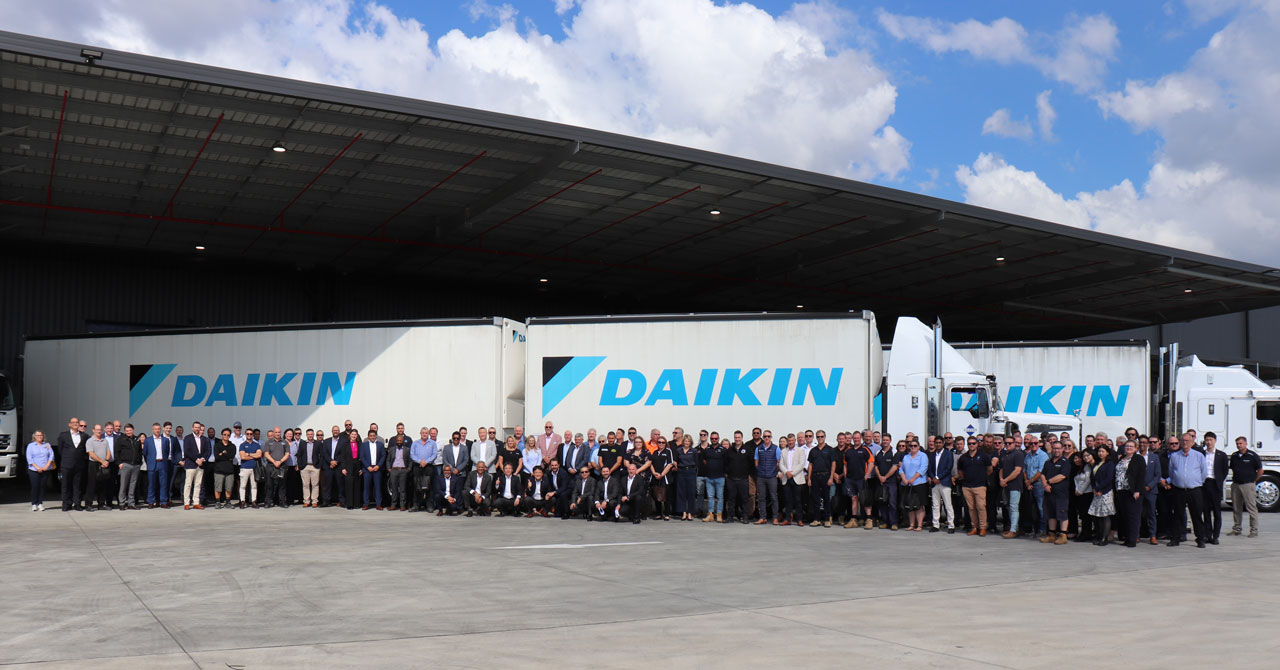 Image 3: Guests gathered in front of a Daikin B-Double during the opening of Daikin Park Brisbane this week.